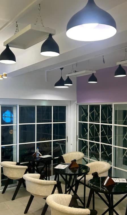 Zestro cafe interior with pendant lights and lounge seating
